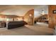 Inviting bedroom featuring wood-paneled walls and access to living area, creating a cozy and functional layout at 1319 N New Jersey St, Indianapolis, IN 46202