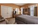 Warm-toned bedroom with a classic dresser, a large closet, and a comfortable bed, for a cozy and traditional feel at 1319 N New Jersey St, Indianapolis, IN 46202