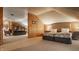 Open bedroom with neutral colors and an adjacent living area creates a relaxing and inviting space at 1319 N New Jersey St, Indianapolis, IN 46202