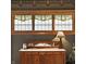 Charming buffet with decorative stained-glass windows above, adding unique character to the home at 1319 N New Jersey St, Indianapolis, IN 46202