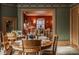 Elegant dining room featuring hardwood floors and original architectural details leading into the living room at 1319 N New Jersey St, Indianapolis, IN 46202