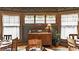 Cozy dining room with stained glass windows and antique buffet at 1319 N New Jersey St, Indianapolis, IN 46202