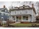 Charming multi-story home with welcoming front porch and wrought iron fence at 1319 N New Jersey St, Indianapolis, IN 46202