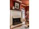 Living room showing the fireplace with white molding and vintage decorations at 1319 N New Jersey St, Indianapolis, IN 46202