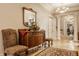 Inviting foyer showcasing hardwood floors, elegant lighting, and a decorative antique sideboard with mirror at 1319 N New Jersey St, Indianapolis, IN 46202