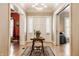 Grand foyer featuring hardwood floors, a decorative rug, and an elegant table with floral arrangement at 1319 N New Jersey St, Indianapolis, IN 46202