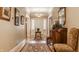 Welcoming foyer boasts hardwood floors, decorative rugs, and an antique sideboard perfect for storage and decor at 1319 N New Jersey St, Indianapolis, IN 46202