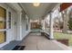 Spacious front porch with porch swing and white columns, offering a relaxing outdoor space at 1319 N New Jersey St, Indianapolis, IN 46202
