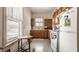 Bright kitchen with wooden cabinets, tile flooring, and natural light at 1319 N New Jersey St, Indianapolis, IN 46202