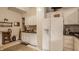 A classic kitchen featuring white cabinets and a white refrigerator at 1319 N New Jersey St, Indianapolis, IN 46202