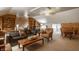 Inviting living room features comfortable sofas, wood-paneled walls, and ample natural light creating a cozy retreat at 1319 N New Jersey St, Indianapolis, IN 46202