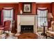 Comfortable living room featuring a fireplace, seating, and natural light from windows at 1319 N New Jersey St, Indianapolis, IN 46202
