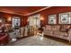 Elegant living room with warm red walls, hardwood floors, and comfortable seating at 1319 N New Jersey St, Indianapolis, IN 46202