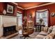 Charming living room with fireplace, detailed molding, and warm, inviting colors at 1319 N New Jersey St, Indianapolis, IN 46202
