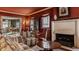Living room showcasing fireplace, seating area, and seamless flow to dining room at 1319 N New Jersey St, Indianapolis, IN 46202