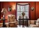 Relaxing living room area featuring table with decor and accent floral chair at 1319 N New Jersey St, Indianapolis, IN 46202