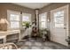 Bright sunroom features multiple windows, wood accents, and space for relaxation or a reading nook at 1319 N New Jersey St, Indianapolis, IN 46202