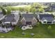 Aerial view of home with large backyard, patio and outdoor fire pit with mature landscaping at 16395 La Paloma Ct, Noblesville, IN 46060