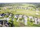 Aerial view of a community on a golf course with mature trees and landscaping at 16395 La Paloma Ct, Noblesville, IN 46060