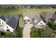Aerial view of a beautiful home near a golf course with mature trees and well-kept lawns at 16395 La Paloma Ct, Noblesville, IN 46060