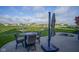 Charming patio area with table and chairs, ideal for relaxing outdoors with scenic neighborhood views at 16395 La Paloma Ct, Noblesville, IN 46060