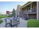 Cozy backyard with patio dining set, complemented by lush landscaping and a covered deck at 16395 La Paloma Ct, Noblesville, IN 46060