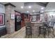 Finished basement bar with brick accents and seating at 16395 La Paloma Ct, Noblesville, IN 46060