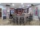 Finished basement bar with brick accents and seating at 16395 La Paloma Ct, Noblesville, IN 46060