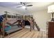 Basement bedroom with built-in bunk beds and sitting area at 16395 La Paloma Ct, Noblesville, IN 46060