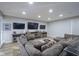 Spacious basement living area with sectional sofa and large TV at 16395 La Paloma Ct, Noblesville, IN 46060