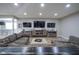 Spacious basement living area with sectional sofa and large TV at 16395 La Paloma Ct, Noblesville, IN 46060