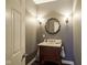 Elegant powder room with pedestal sink and decorative mirror at 16395 La Paloma Ct, Noblesville, IN 46060