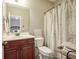 Clean bathroom with a shower/tub combo and wood vanity at 16395 La Paloma Ct, Noblesville, IN 46060