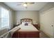 Bright bedroom with a queen-size bed and wood furniture at 16395 La Paloma Ct, Noblesville, IN 46060