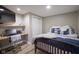 Basement bedroom with built-in desk and full-size bed at 16395 La Paloma Ct, Noblesville, IN 46060