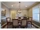 Elegant dining room with a large table, chandelier, and hardwood floors at 16395 La Paloma Ct, Noblesville, IN 46060