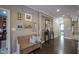 Spacious entryway with hardwood floors and a wooden bench at 16395 La Paloma Ct, Noblesville, IN 46060