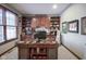 Spacious home office features built-in shelves and large windows at 16395 La Paloma Ct, Noblesville, IN 46060
