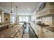 Kitchen with granite counters, white cabinets, and gas cooktop at 16395 La Paloma Ct, Noblesville, IN 46060