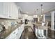 Modern kitchen with granite countertops and white cabinets at 16395 La Paloma Ct, Noblesville, IN 46060