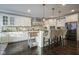 White kitchen with stainless steel appliances and an island at 16395 La Paloma Ct, Noblesville, IN 46060