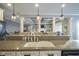 Island kitchen with granite counters and a farmhouse sink at 16395 La Paloma Ct, Noblesville, IN 46060