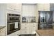 Modern kitchen with stainless steel appliances and granite countertops at 16395 La Paloma Ct, Noblesville, IN 46060