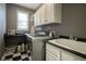 Convenient laundry room with washer, dryer, and ample counter space at 16395 La Paloma Ct, Noblesville, IN 46060