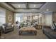Bright and airy living room with comfortable seating and a view into kitchen at 16395 La Paloma Ct, Noblesville, IN 46060