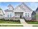 Two-story craftsman home with stone accents and a welcoming front porch at 20035 Meadow Neck Rd, Westfield, IN 46074