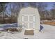 Gray storage shed with double doors in snowy yard at 2054 Horizon Blvd, Greenwood, IN 46143