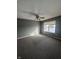 Bedroom featuring neutral carpet, ceiling fan and a window at 2734 Mingo Ct, Indianapolis, IN 46217