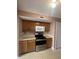 Kitchen featuring wooden cabinets and stainless steel appliances at 2734 Mingo Ct, Indianapolis, IN 46217
