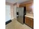 Kitchen featuring a stainless steel refrigerator and wooden cabinets at 2734 Mingo Ct, Indianapolis, IN 46217